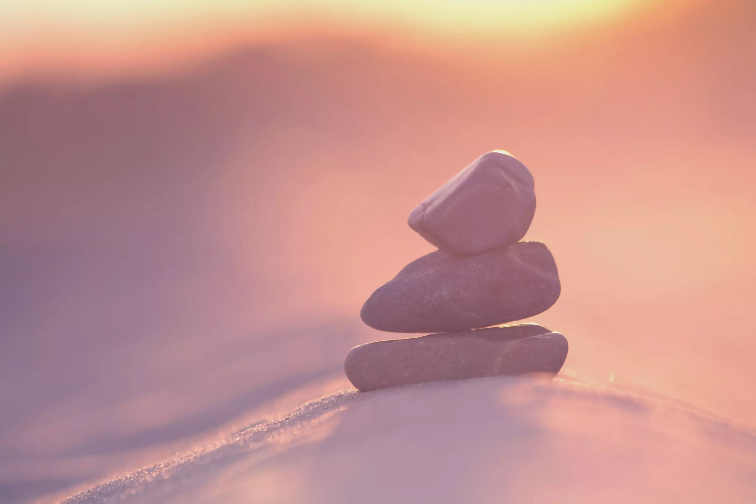 Zen stones in sunset light, peaceful balance